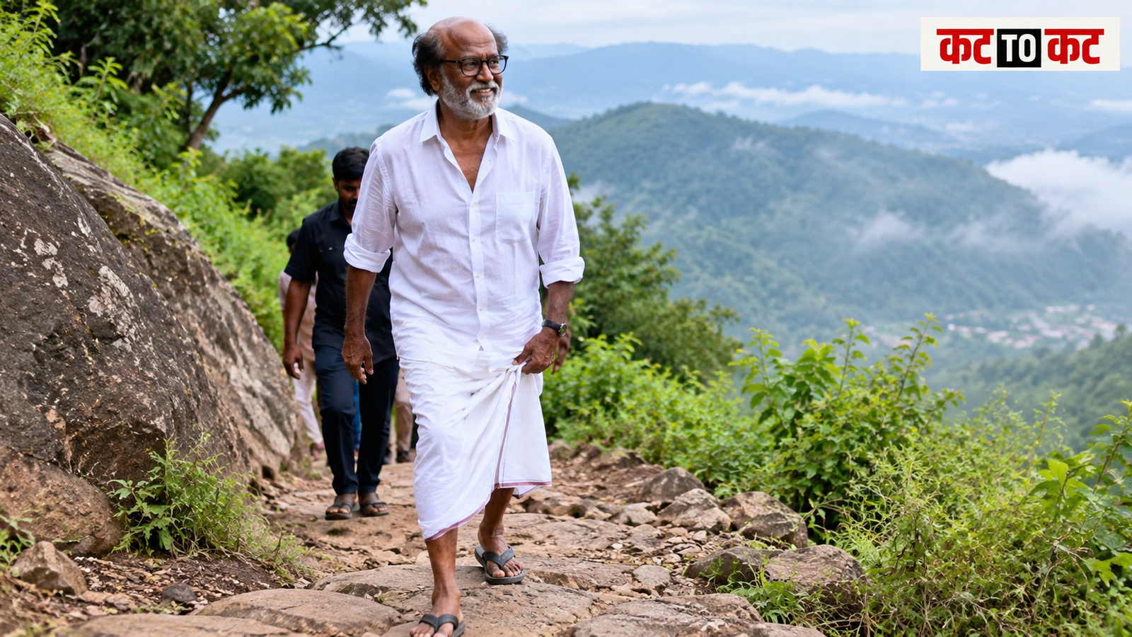 Rajinikanth walking on a mountain in a simple shirt, veshti and slippers